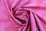 Swirled swatch near solid print fabric in pink