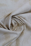 Swirled swatch near solid print fabric in off white