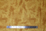 Flat swatch near solid print fabric in gold