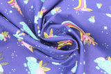 Swirled swatch blue fabric (dark blue fabric with small tossed emblems allover rainbows with floral/greenery, small teal and yellow snails with pink flower petals, teal coloured rocks, tiny teal and yellow dots and stars)