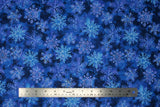 Flat swatch Blue fabric (dark blue fabric with various shades of blue realistic look snowflakes collaged allover with silver sparkles)
