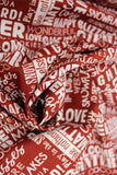 Swirled swatch winter printed fabric in Text on Red (winter words)