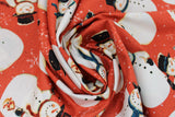 Swirled swatch winter printed fabric in Snowmen on Red