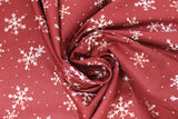 Swirled swatch winter printed fabric in White Snowflakes on Burgundy
