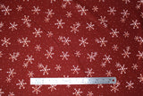 Flat swatch winter printed fabric in White Snowflakes on Burgundy