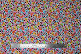 Flat swatch Spring Floral fabric (white fabric with busy tossed simple style floral and butterflies and lady bugs collaged all together in yellow, orange, pink, red, blue, green, etc. shades)
