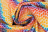 Swirled swatch rainbow patches fabric (white fabric with thick rainbow stripes comprised of small organic shaped dots/patches)