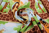 Swirled swatch World of Susybee printed fabric in Giraffe