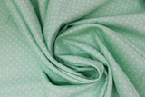 Swirled swatch swiss dot printed fabric in mint