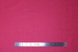 Flat swatch swiss dot printed fabric in pink