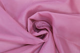 Swirled swatch dusty rose sheer fabric