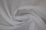 Swirled swatch white sheer fabric