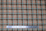 Flat swatch dark brown plaid fabric (dark brown plaid squares with maroon, orange, and blue plaid lines)