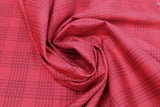 Swirled swatch yuletide themed printed fabric in Red Plaid