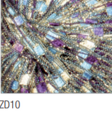 Swatch of Zodiac metallic ladder yarn in shade ZD10 (silver, blue, and purple shades)