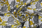 Swirled swatch Zoo Animals fabric (white fabric with doodle style zoo animals in grey and yellow shades allover: elephants, giraffes, birds, monkeys, bees)