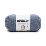 A ball of Bernat Bundle Up yarn in shade Beluga (pale dark blue)