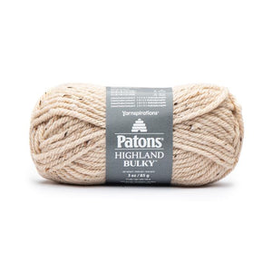 A ball of Patons Highland Bulky yarn in shade Wheat (pale creamy beige/white with subtle brown flecks)