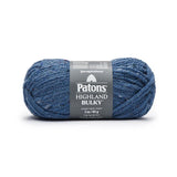 A ball of Patons Highland Bulky yarn in shade Indigo (deep medium blue with pale blue flecks)