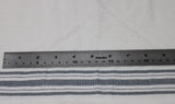 Flat swatch tea towelling material with grey stripe accents on white