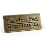 Metal Bag Label: "Handcrafted - Made in Canada"