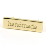 Metal Bag Label: "handmade"