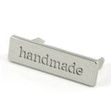 Metal Bag Label: "handmade"