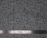 Flat swatch alphabet graphics printed fabric in silver (grey fabric with tossed dark grey letters of the alphabet in various styles/fonts)