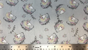 Group swatch cartoon unicorn head printed fabric in various colours
