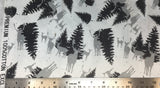 Flat swatch deer and pine trees printed fabric in silver (white fabric with tossed snow specks, deer and pine tree silhouettes in grey/silver shades)