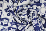 Swirled swatch licensed NHL fabric in Toronto Maple Leafs (quilt squares pattern with blue and white backgrounds with opposite colour logo in each square)