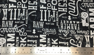 Group swatch farm to fork large font text printed fabric in black and cream