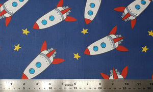 Group swatch cartoon rocketships fabric in various colours