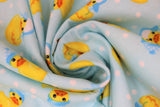 Swirled swatch rubber ducky fabric (baby blue fabric with white polka dots and tossed yellow rubber duckies in blue and white winter hats)
