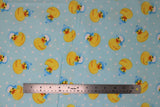 Flat swatch rubber ducky fabric (baby blue fabric with white polka dots and tossed yellow rubber duckies in blue and white winter hats)