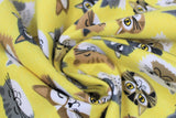 Swirled swatch comfy print flannel in cats (happy cartoon cat heads/faces on yellow)