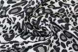 Swirled swatch leopard print upholstery fabric (light grey fabric with dark grey and black leopard print)