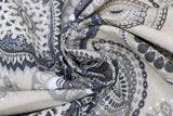 Swirled swatch upholstery fabric (grey mandalas print: assorted circular mandala shapes in light to dark greys on lightest grey fabric)