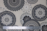 Flat swatch upholstery fabric (grey mandalas print: assorted circular mandala shapes in light to dark greys on lightest grey fabric)