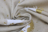 Swirled swatch upholstery fabric (unicorns print: light beige fabric with tossed gold metallic stars and white unicorn heads and bodies with gold metallic manes/tails)