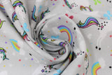 Swirled swatch unicorn and rainbows fabric (light grey fabric with tossed white unicorns with rainbow coloured mains and tails, tossed rainbows with clouds, tossed hearts and butterflies in white and rainbow colours)