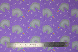 Flat swatch unicorns flannel fabric (lavender purple fabric with small tossed grey unicorn head silhouettes with rainbow coloured horns, tossed small and medium white stars)