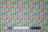 Flat swatch Easter Harlequin fabric (white fabric with diamond harlequin print in pastel rainbow colours allover)