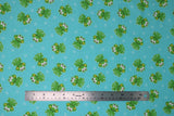 Flat swatch frogs fabric (light blue/green fabric with tossed green cartoon smiling frogs allover and white small bubbles)