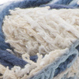 Scrub Off yarn swatch in shade denim (white and assorted faded blues)