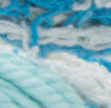 Scrub Off yarn swatch in shade spring blue (white, light and bright blues)