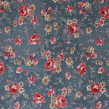 Square swatch Farmhouse Chic floral fabric (faded blue denim look fabric with small and medium tossed floral allover in pale red, cream, blue with leaves and greenery in pale tones)