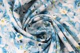 Swirled swatch Layered Watercolour fabric (white and blue watercolour look floral heads collaged allover)