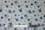 Flat swatch White Toss fabric (white fabric with tossed blue floral heads and clusters with greenery)
