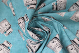 Swirled swatch homemade themed printed fabric in stoves (old fashioned white/silver stove on blue with white dots)